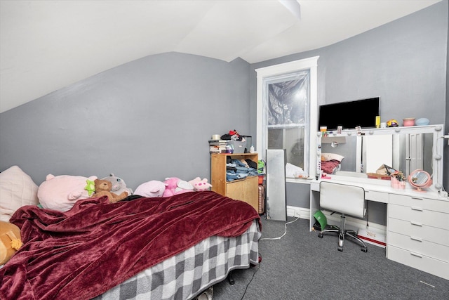 carpeted bedroom with lofted ceiling