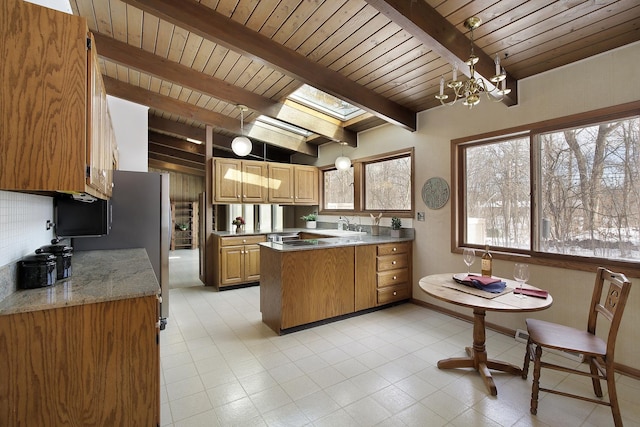 kitchen with vaulted ceiling with beams, decorative backsplash, hanging light fixtures, wood ceiling, and a chandelier