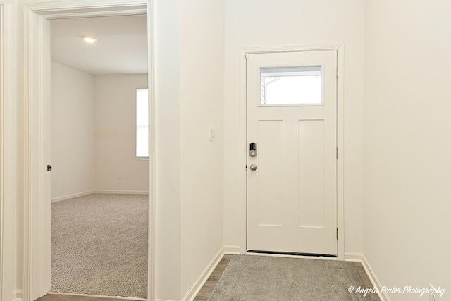 view of carpeted entrance foyer