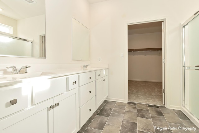 bathroom with vanity and an enclosed shower