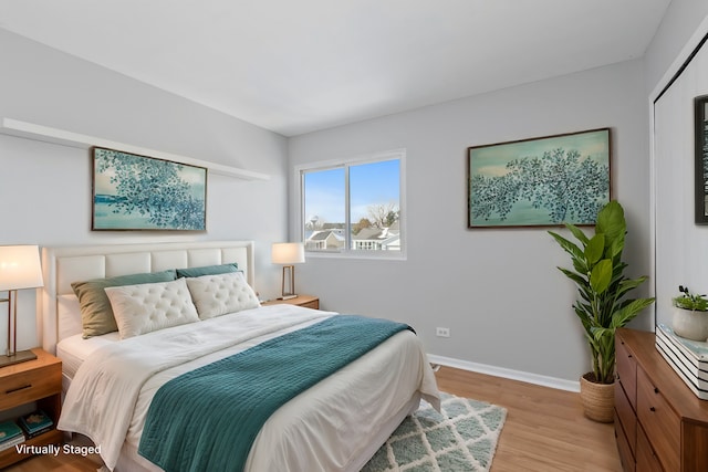 bedroom with light wood-type flooring