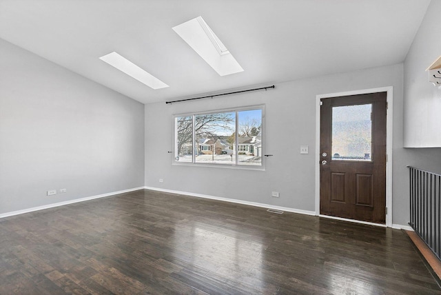 foyer featuring lofted ceiling and dark wood-type flooring