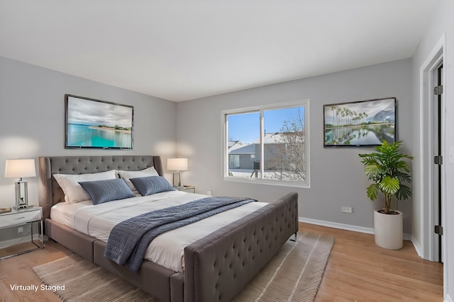 bedroom with light hardwood / wood-style flooring