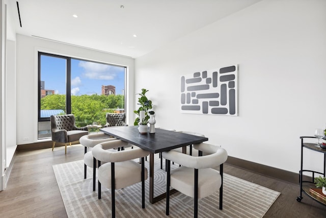 dining area with wood-type flooring