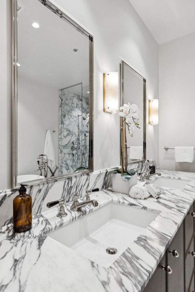 bathroom featuring vanity and a shower with door