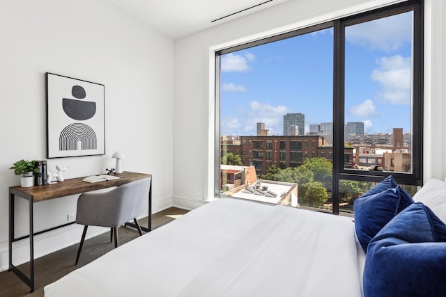 bedroom featuring dark hardwood / wood-style flooring