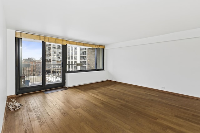 spare room with hardwood / wood-style flooring