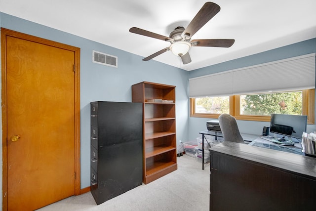 home office featuring ceiling fan and light colored carpet