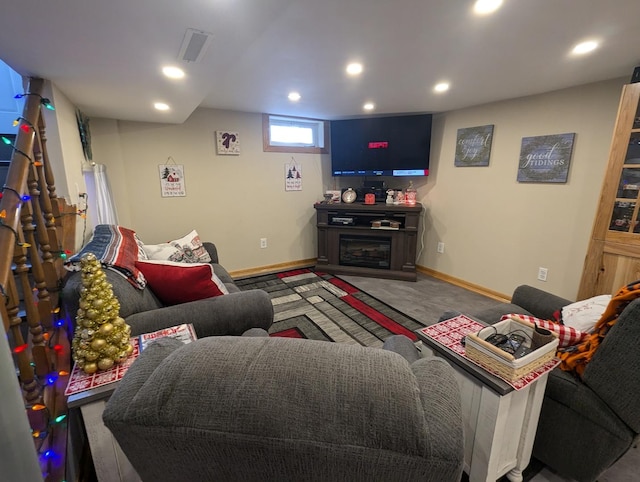 carpeted living room with a fireplace