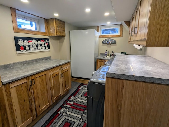 kitchen with sink and white fridge