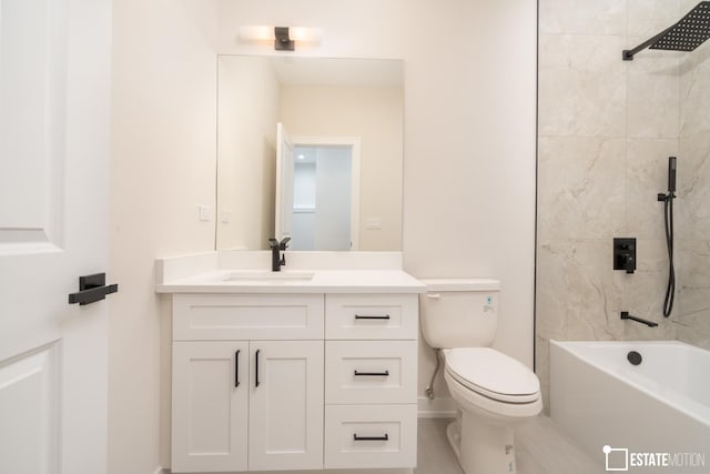 full bathroom with toilet, vanity, and tiled shower / bath