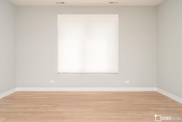 unfurnished room featuring light hardwood / wood-style flooring