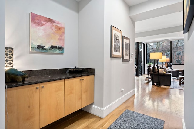 corridor featuring light hardwood / wood-style floors