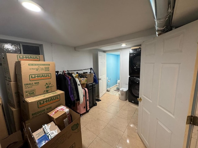 basement with stacked washer / drying machine