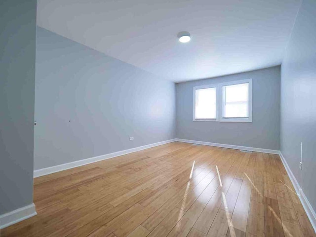 empty room with light hardwood / wood-style floors