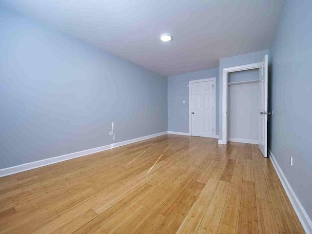 unfurnished bedroom featuring light wood-type flooring