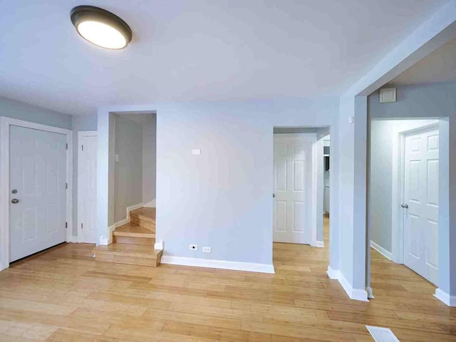 spare room with light wood-type flooring