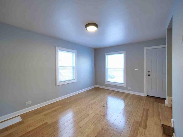 foyer entrance with light hardwood / wood-style floors