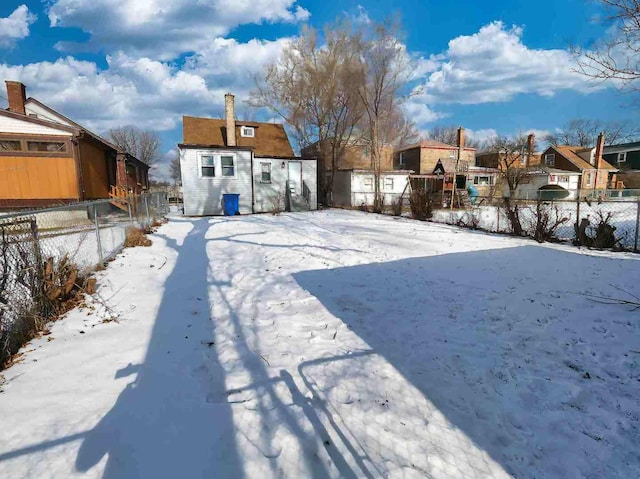 view of yard layered in snow