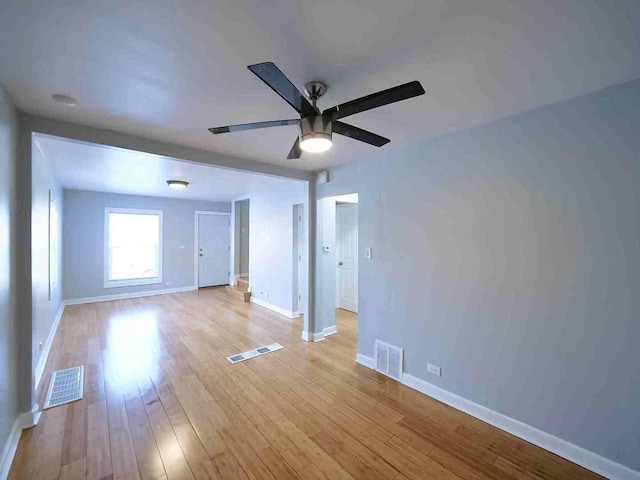 spare room with ceiling fan and light hardwood / wood-style floors