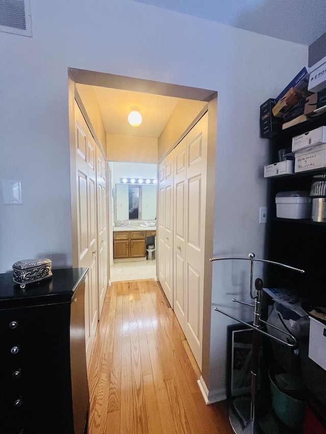 hallway with light wood-type flooring