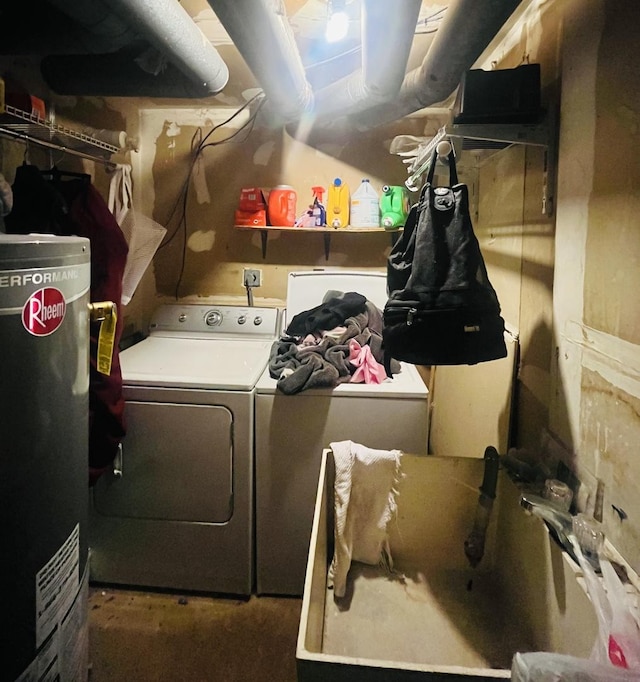 laundry area with water heater and washer and clothes dryer