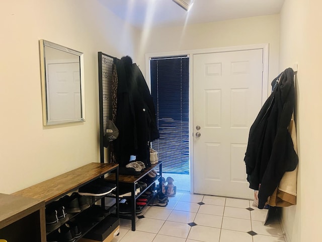 foyer featuring light tile patterned floors