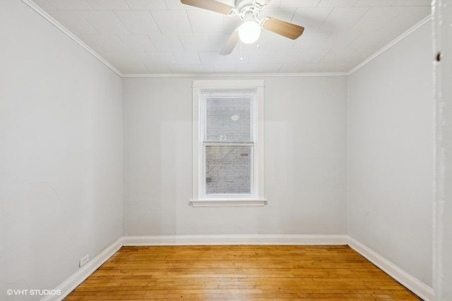 empty room with crown molding, ceiling fan, and light hardwood / wood-style flooring