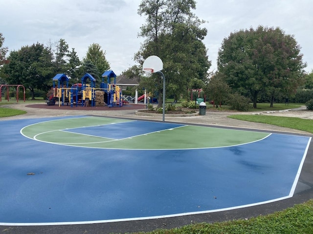 view of sport court featuring playground community and community basketball court