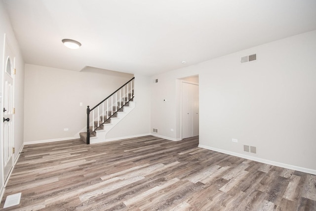 unfurnished room with hardwood / wood-style floors