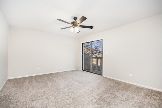 empty room featuring carpet floors and ceiling fan