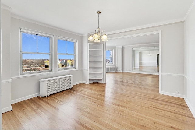 unfurnished dining area with plenty of natural light, radiator, light hardwood / wood-style floors, and a notable chandelier