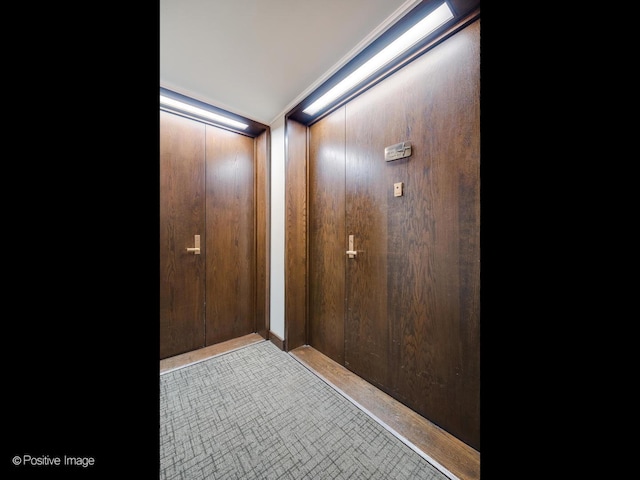 details featuring crown molding and wood walls