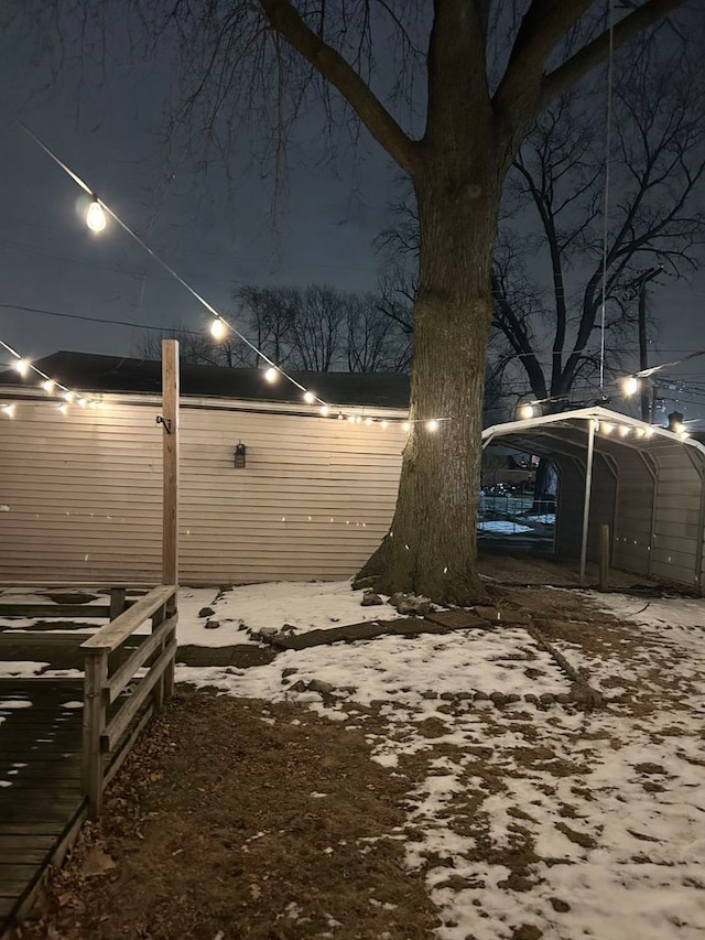 yard at twilight featuring a carport