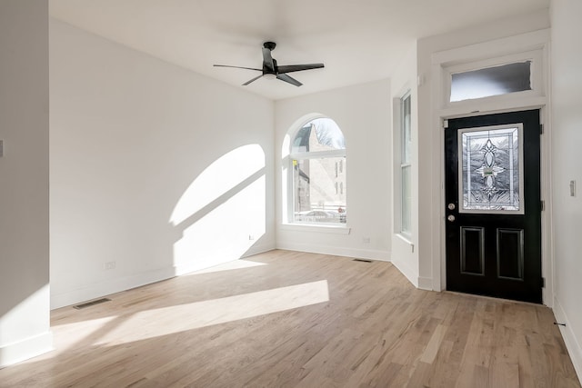 foyer with ceiling fan and light hardwood / wood-style flooring