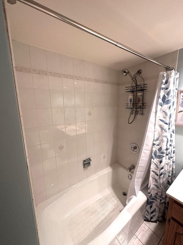 bathroom featuring shower / bath combination with curtain, vanity, and tile patterned flooring