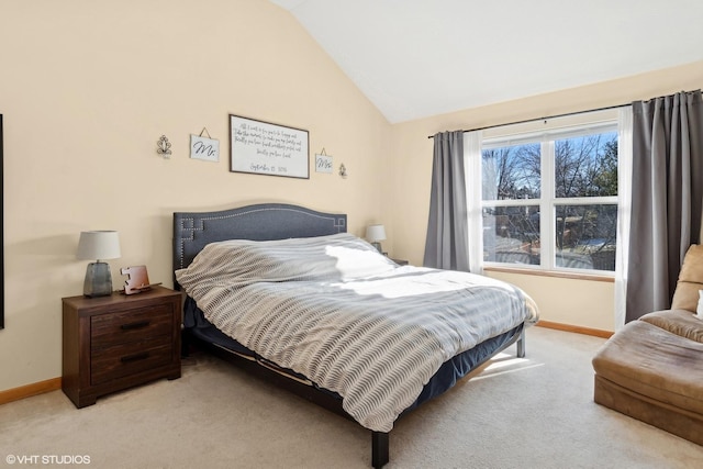 carpeted bedroom with vaulted ceiling