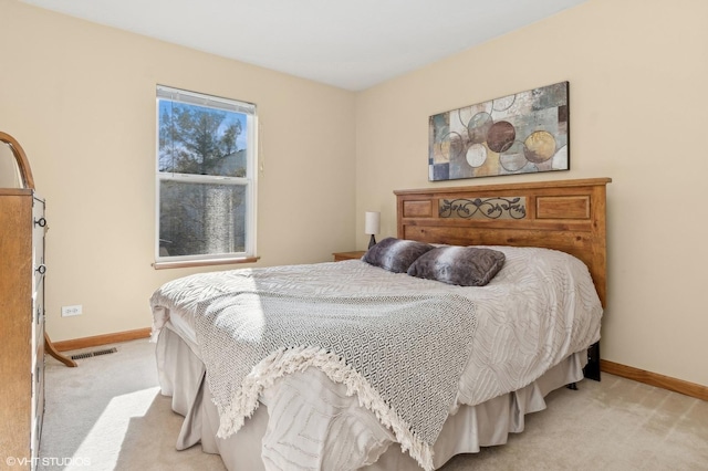 bedroom with light carpet