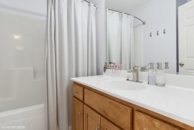 bathroom with vanity and shower / bath combo with shower curtain