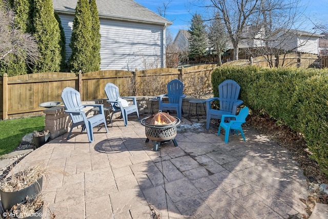 view of patio / terrace featuring an outdoor fire pit