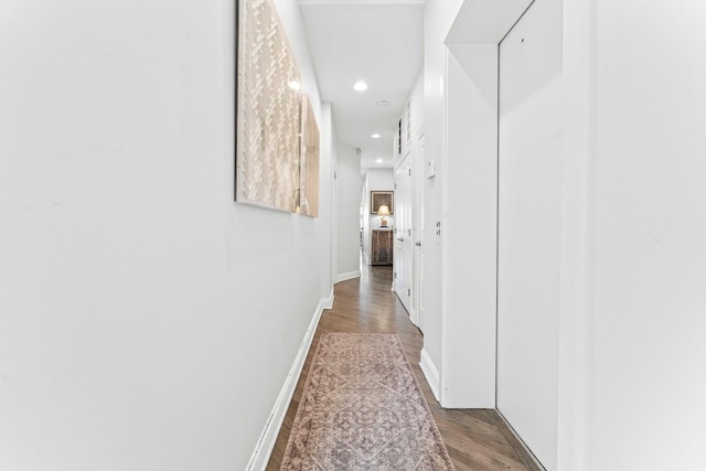 corridor featuring dark wood-type flooring