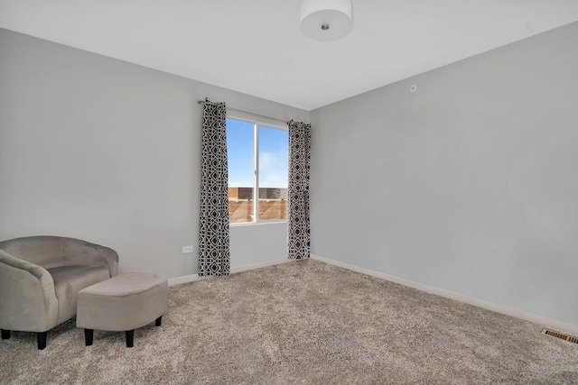 sitting room featuring carpet floors