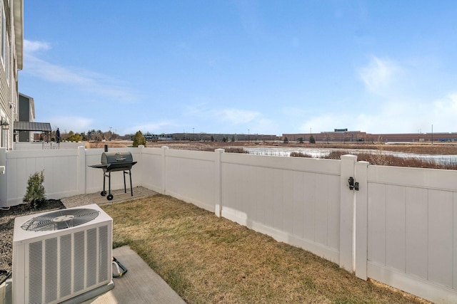 view of yard with central AC unit