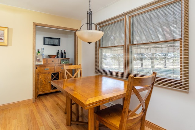 dining area with light hardwood / wood-style floors