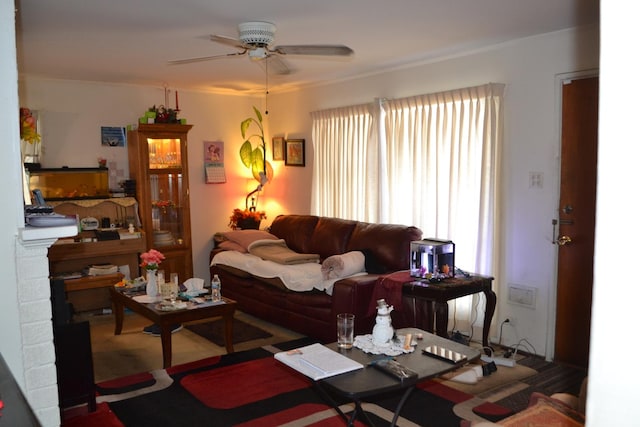 living room featuring ceiling fan and carpet floors