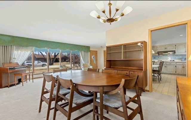 dining space featuring an inviting chandelier