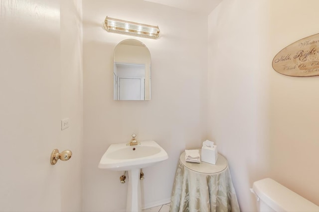 bathroom with sink and toilet