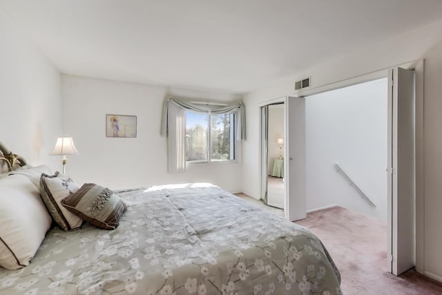 carpeted bedroom with a closet