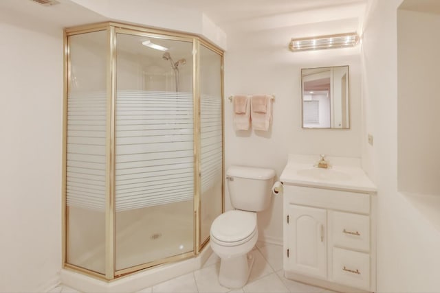 bathroom with vanity, tile patterned floors, toilet, and walk in shower