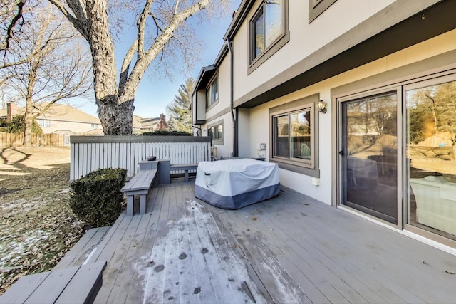 wooden deck with a grill